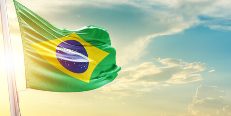 Fototapeta na wymiar Brazil national flag cloth fabric waving on the sky - Image