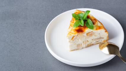 Baked Sweet Cottage Cheese casserole with apple decorated mint. Copy space