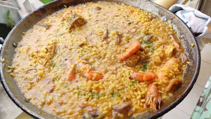 Typical spanish seafood paella in traditional pan