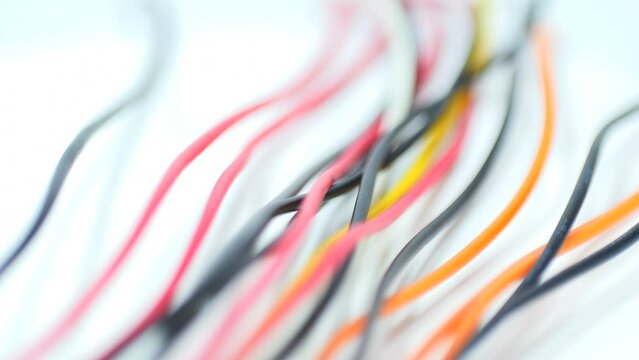 multicolored wire cable of usb and adapter isolated on white background.Electronic Connector.Selection focus.Slow motion macro footage.