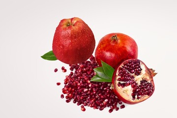 Fresh ripe red pomegranate and apples fruits