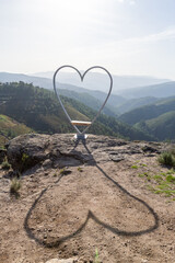 Heart shaped seat and shadow with a view to the mountains