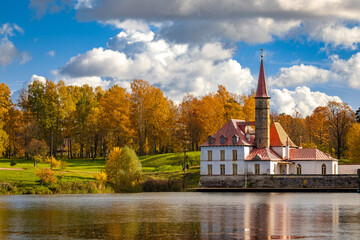 Priory Palace on the shore of the lake in Gatchina near St. Petersburg in the autumn afternoon, the...