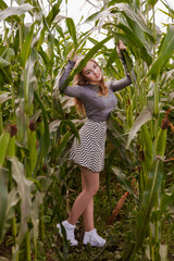 beautiful young woman in a corn field