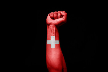 Man's hand in a fight signal with the countries flag.