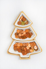 Happy christmas tree made of golden coins,