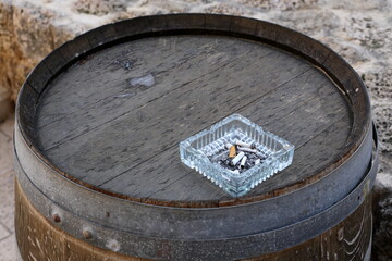 Ashtray for tobacco ash and used tobacco products.