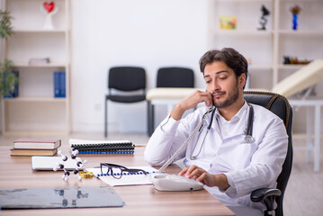 Young male doctor in telemedicine concept