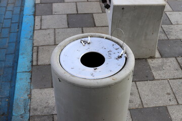 Ashtray for tobacco ash and used tobacco products.