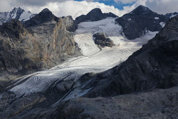 The alpine peaks and vanishing glaciers in South Tyrol near to  Stelvio Pass, National Park, Italy - obrazy, fototapety, plakaty