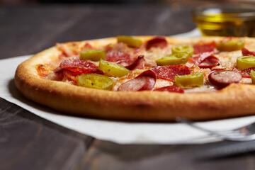 tasty pizza on the wooden background
