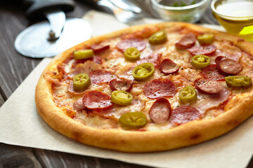 tasty pizza on the wooden background