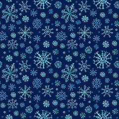 Seamless winter pattern. Blue watercolor snowflakes on a dark blue background. Hand drawn illustration.