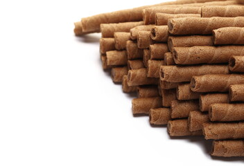 Waffle chocolate sticks with of cream black chocolate and orange, isolated on white