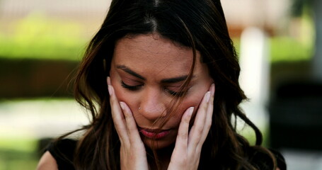 Worried hispanic woman feeling angst and stress