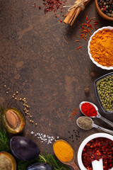 Variety of spices and herbs at table background. Cooking concept and ingredients