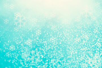 Fototapeta na wymiar Blue bokeh background with snowflakes for christmas, defocused round lights and sunbeams, flare overlay 