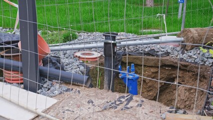 Urban Waterworks Plumbing System Pipes Maintenance Site Secured with Metal Grid Fence