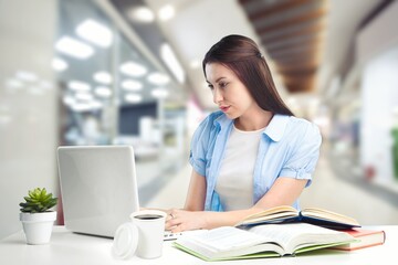Woman student using computer laptop.