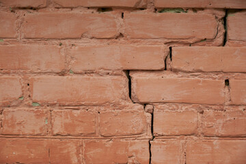 red brick wall with crack