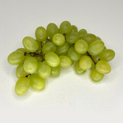 Bunch of green grapes on a white background