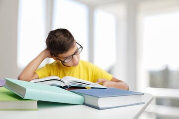 Young child study on lesson with book