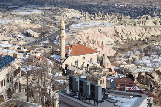 town in winter fairy chimneys tent rock hoodoo erath pyramid  cappadocia