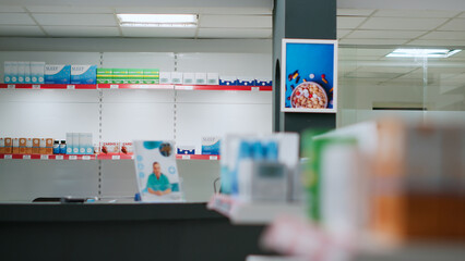 Empty pharmacy shop with boxes and packages on medicaments, retail store shelves with pharmaceutical products. Drugstore space filled with medical drugs and pills, supplement containers.