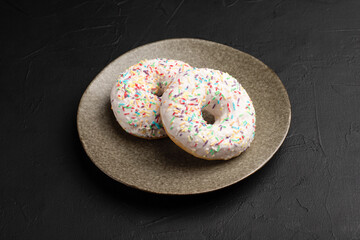 Donut, dessert donuts on a black background