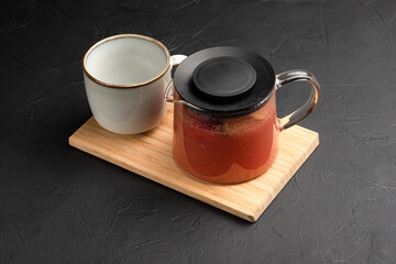 Tea, hot fruit teas on a black background