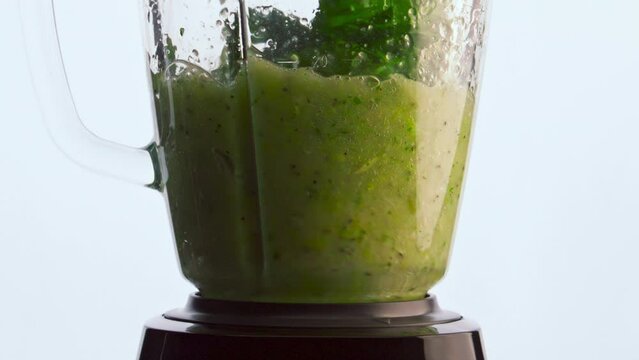 Cooking vegetable cocktail blender close up. Process blending organic veggies.