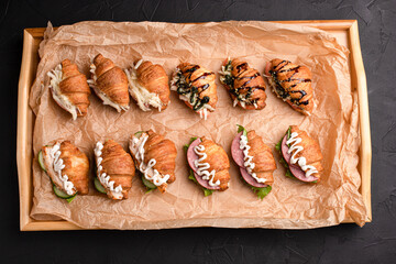 Croissants with fillings, croissants with different fillings on a black background