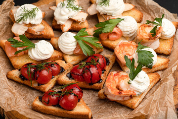 Bruschetta, different bruschetta with different fillings on a black background