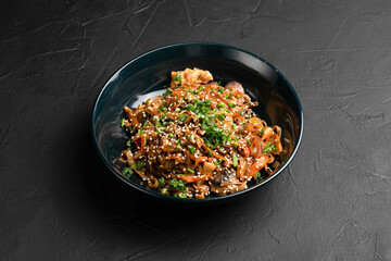 Wok, wok noodles with different fillings on a black background