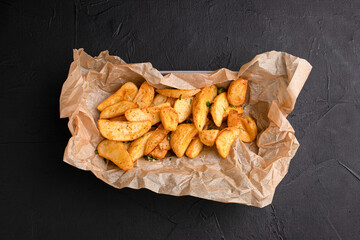 French fries, French fries for beer on a black background