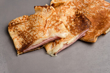 Pancakes, pancakes with different fillings on a black background