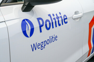 Police car in Belgium. Emblem and name of Belgian police. Side view of a police car with the lettering "Police. The Belgian Federal Police © Ajdin Kamber