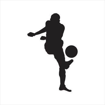 silhouette of a football player dribbling the ball.