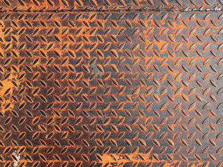 Rusty floor steel panel. Grunge tread plate with orange rust