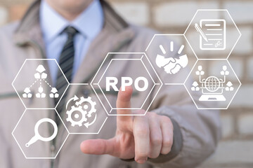 Businessman using virtual touchscreen presses abbreviation: RPO. Concept of RPO Recruitment Process...