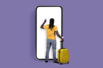 Back view of black man tourist using big smartphone, mockup