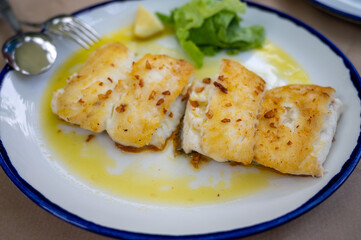 Grilled fillet of white codfish served in fish restaurant in San Sebastian, Basque Country, Spain