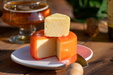 Food and drink pairing, apple cider produced on organic farm from bio apples in Normandy, France and cheddar cheese from England