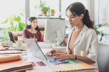 Obraz premium Professional interior designer working in her office