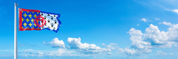 Pays de la Loire - France flag waving on a blue sky in beautiful clouds - Horizontal banner

