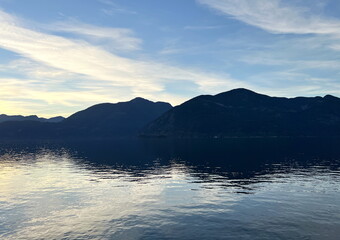 Background for travel travel agency Porteau Cove Provincial Park Sunset city immersed in water reflecting in the Pacific Ocean creating mirror image The camera moves slowly capturing beauty of nature 