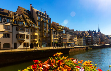 Sunny summer day in Strasbourg, Grand Est region of eastern France. View of houses along canal.