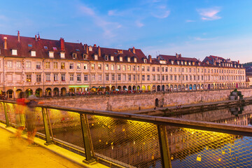 Scenic view from Battant bridge of lively Quai Vauban in French city of Besancon along Doubs river...