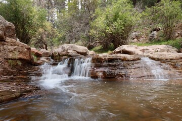 Naklejka na ściany i meble A little waterfall along Tonto Creek, just under the Mogollon Rim in Northern Arizona. 