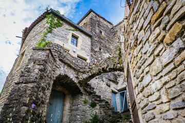 View on the beautiful stone facades and medieval houses of the small historical village of Rochecolombe in the South of France (Ardeche)